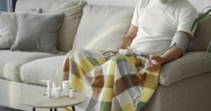 A old person measuring blood pressure at home